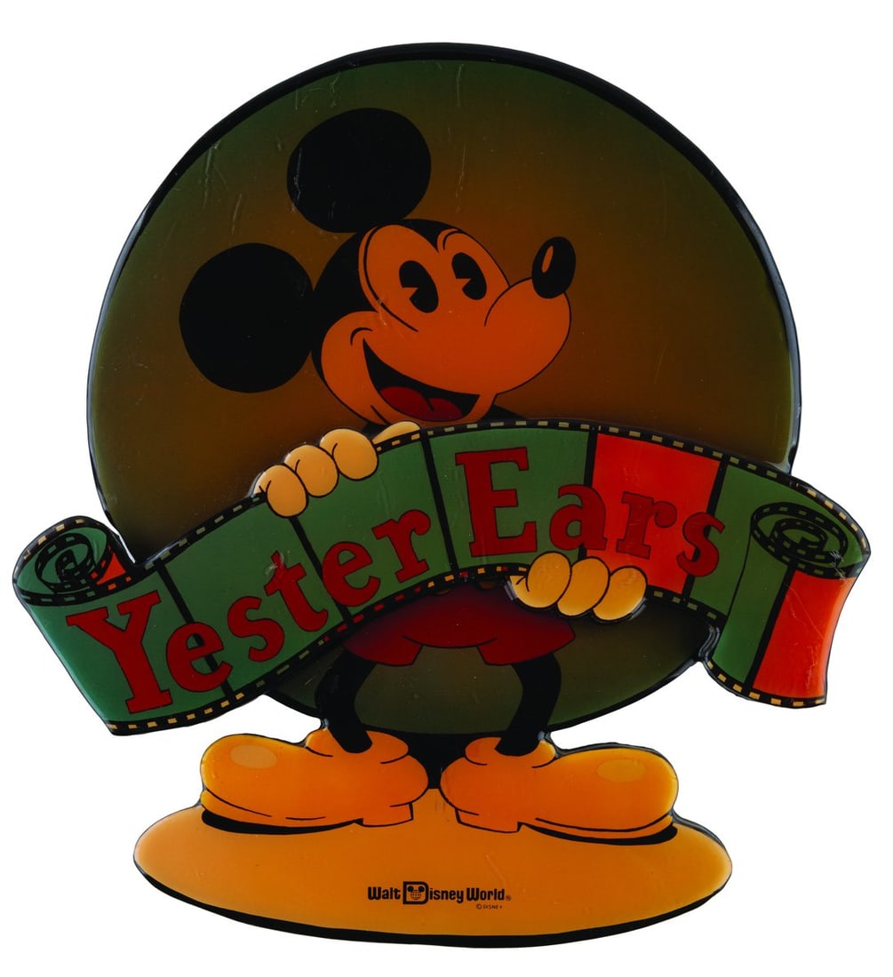 A Pleasure Island YesterEars Sign.: (Walt Disney World, 1989-93) A sign for YesterEars, the former merchandise shop in Pleasure Island. Measuring 16" x 17", the sign is in fair condition with heavy scratches throughout, discoloration