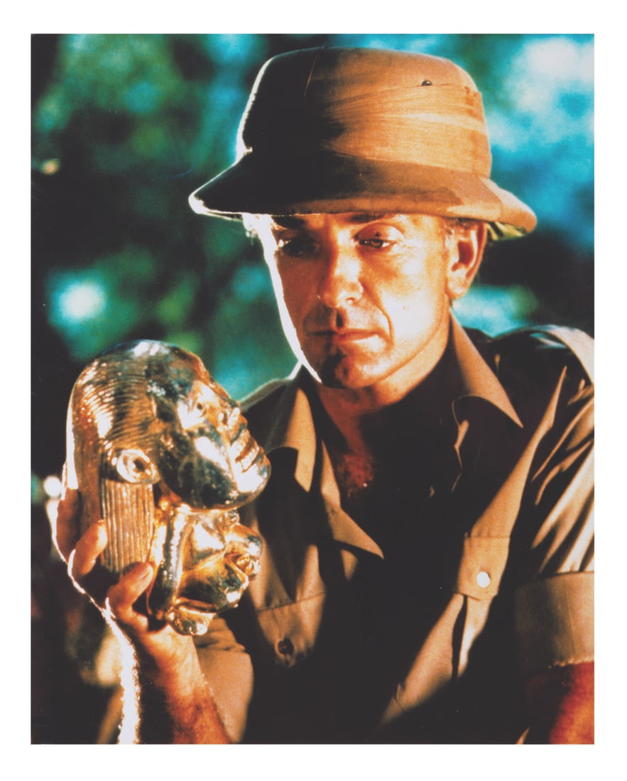 A “Raiders of the Lost Ark?? Belloq Photo.: (Paramount, 1981) A recent print of actor Paul Freeman as Belloq, contemplating the Golden Idol in “Raiders of the Lost Ark.” Measuring 8” x 10”, the color photo is in fine