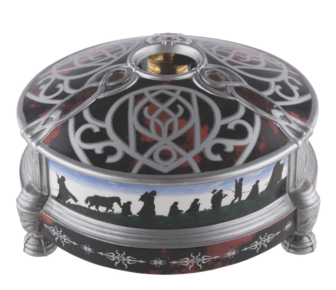 A "The Lord of the Rings" Holographic Image Chamber.: (The Noble Collection, 2001) A The One Ring Mirage Holographic Chamber by The Noble Collection, inspired by "The Lord of the Rings: The Fellowship of the Ring." Inside the chamber is a replica of The