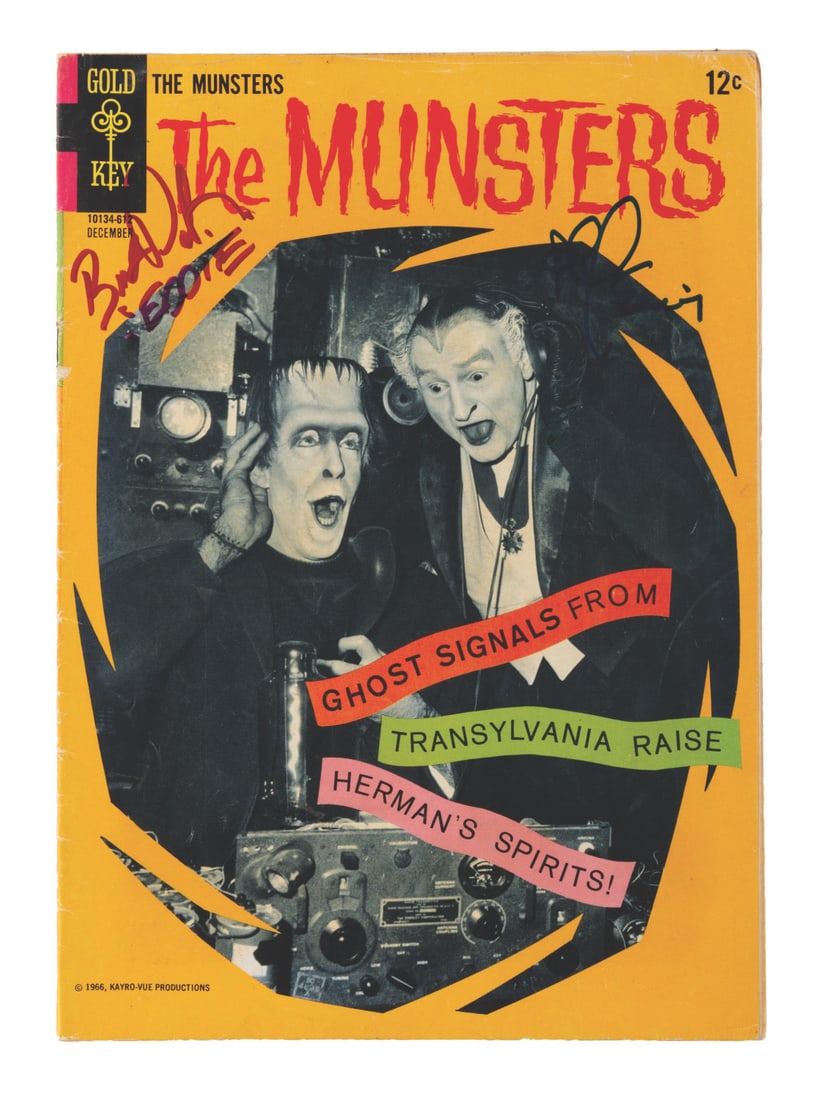 A Signed "The Munsters" Comic Book.: (Gold Key, 1966) Issue 10 of "The Munsters" comic book signed by Butch Patrick (Eddie) and Al Lewis (Grandpa). Measuring 7.25" x 10.25", the comic book is in good condition with creases throughout, so