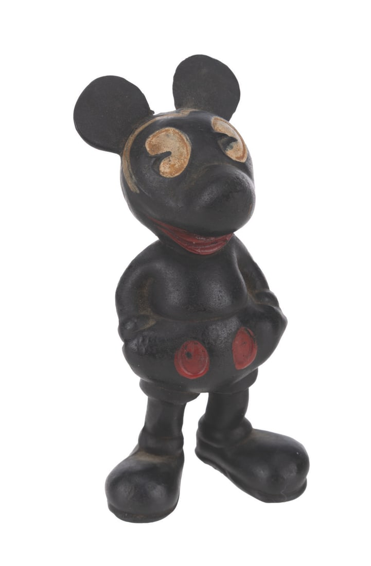 A Seiberling Rubber Mickey Mouse Figure.: (Seiberling, 1930s-40s) A rubber Mickey Mouse figure by Seiberling Latex Products Co. The hard black Mickey figure has a painted red mouth, red buttons, and white eyes. Measuring 3.5” tall, the