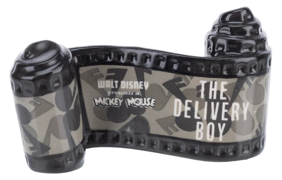 A WDCC "The Delivery Boy" Title Scroll.: (WDCC, 1992-97) A Walt Disney Classics Collection ceramic opening title scroll for the Mickey Mouse short “The Delivery Boy.” Measuring 2" x 3.25", the piece is in fine condition.