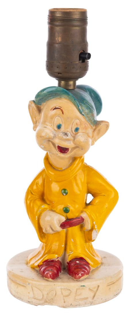 An Early Dopey Lamp.: (Disney, 1930s-40s) A plaster table lamp of Dopey from “Snow White and the Seven Dwarfs.” Measuring 9.5” tall without a bulb, the lamp displays in fair to good condition, functioning