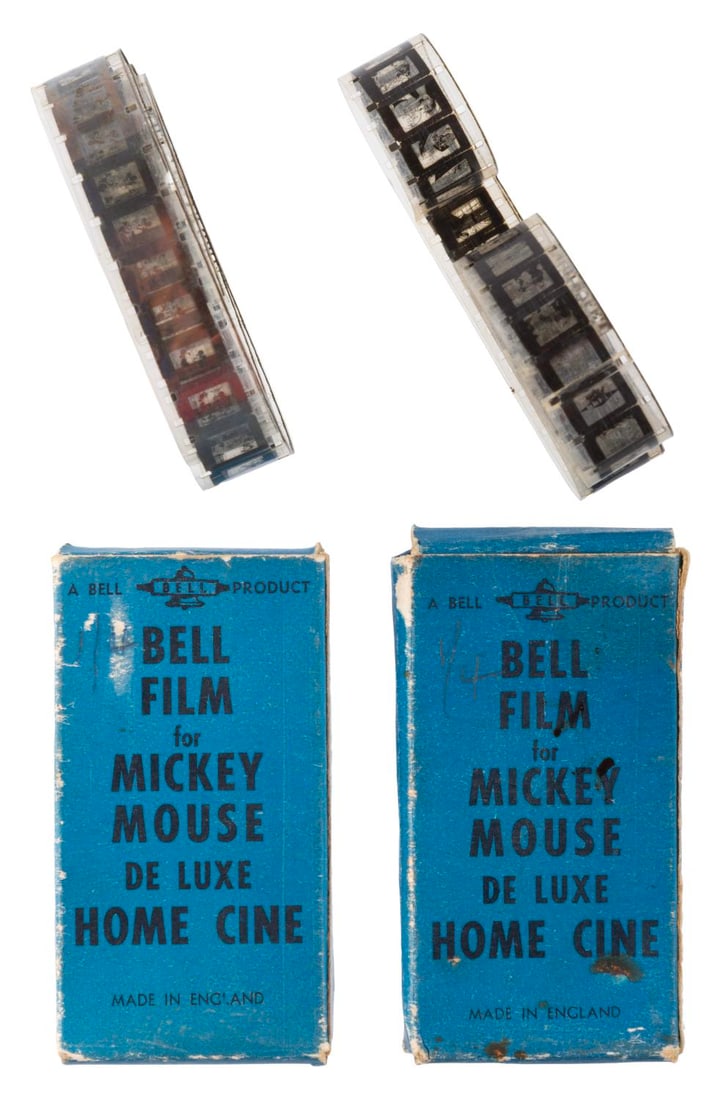 A Pair of Mickey Mouse Home Cine Mini Film strips.: (Bell, 1940s) A pair of Mickey Mouse De Luxe Home Cine films by Bell of England. Each box contains a 16mm film strip loop for a toy home projector. The titles are Donald Duck in “Voyage to Planet