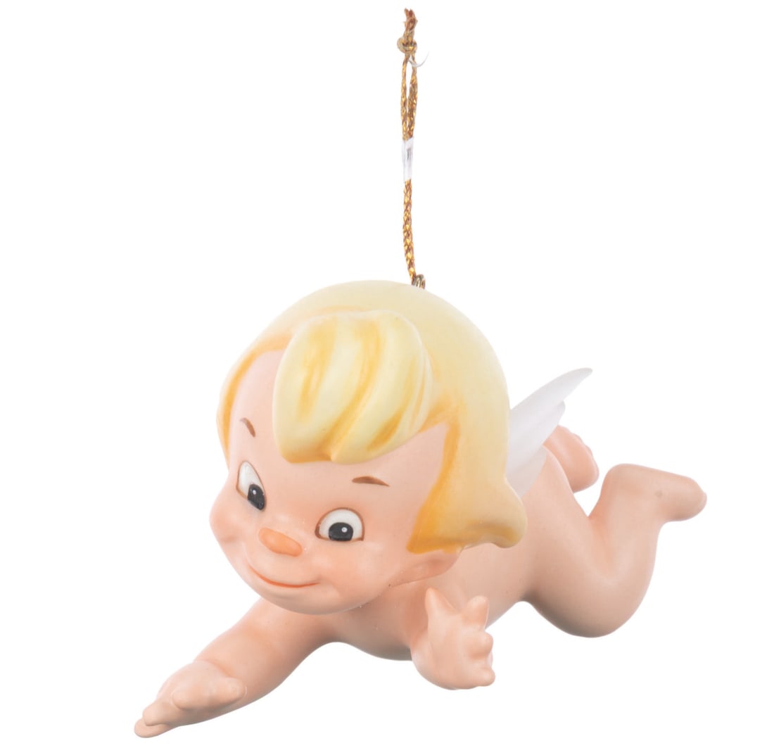 A WDCC "Fantasia " Cupid Ornament.: (WDCC, 1994) A Walt Disney Classics Collection figural Cupid ornament titled "Flight of Fancy," inspired by the Pastoral Symphony segment of "Fantasia." The ornament was sculpted by Kent Melton and