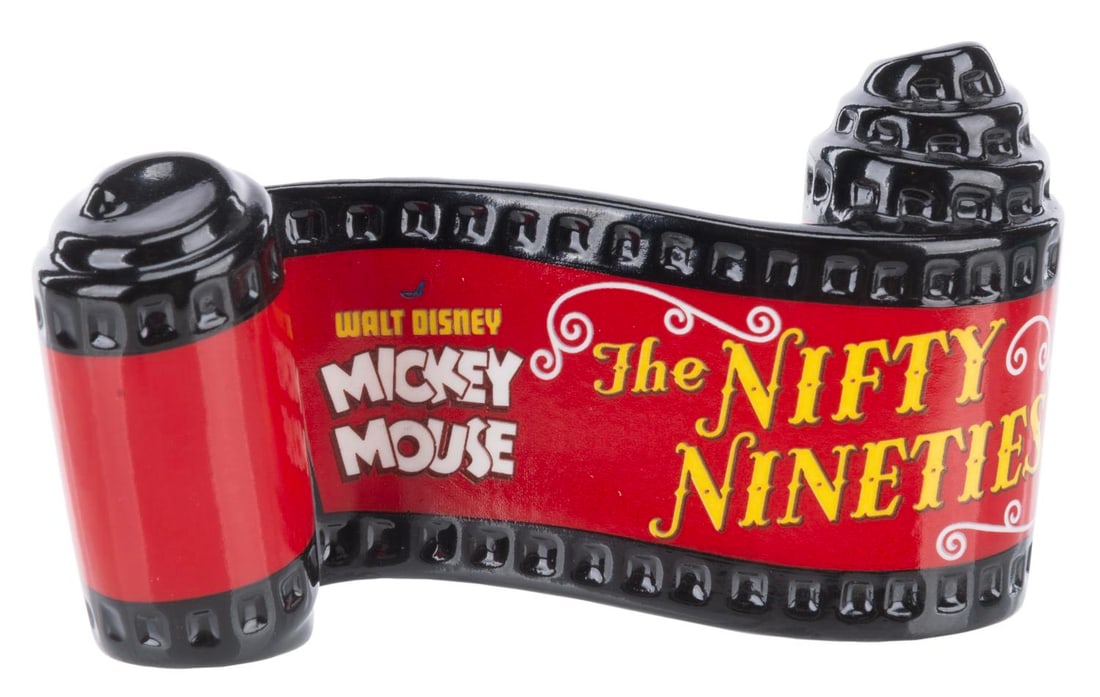 A WDCC "The Nifty Nineties" Title Scroll.: (WDCC, 2002) A Walt Disney Classics Collection ceramic opening title scroll for the Mickey Mouse short "The Nifty Nineties.” Measuring 2" x 3.25", the piece is in fine condition.
