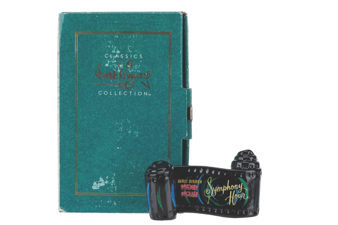 A WDCC "Symphony Hour" Title Scroll.: (WDCC, 1993-97) A Walt Disney Classics Collection ceramic opening title scroll for the Mickey Mouse short “Symphony Hour.” Measuring 2" x 3.25", the item is in fine condition.