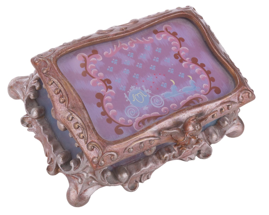 A "Cinderella" Stained Glass Jewelry Box.: (Disney, 1990s-2000s) A stained glass “Cinderella” jewelry box released in a limited edition of 1500. Measuring 5.25” x 7.5” and 3.5” tall, the metal and glass jewelry box is