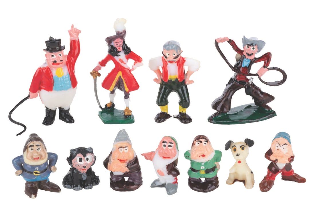 A Collection of Disneykins.: (Marx, 1960s) A collection of 11 hand-painted Disneykin figurines including Pecos Bill, Captain Hook, Geppetto, Figaro, the "Dumbo" Ringmaster, a dalmatian puppy, and five of the Seven Dwarfs.