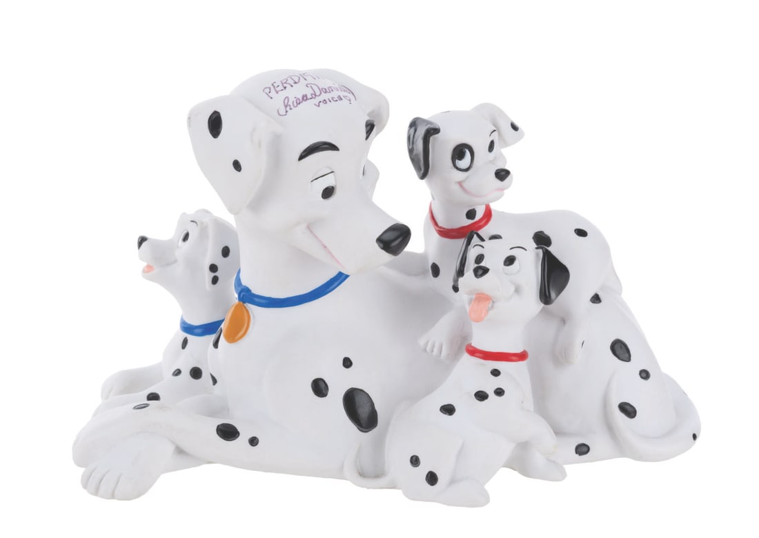 A Signed "One Hundred and One Dalmatians" Perdita Coin Bank.: (Disney, 1990s) A vinyl bank of Perdita and puppies from "One Hundred and One Dalmatians," signed in black marker by Perdita's voice artist, Lisa Daniels. Measuring 6" x 9" x 5.5" tall, the autographe
