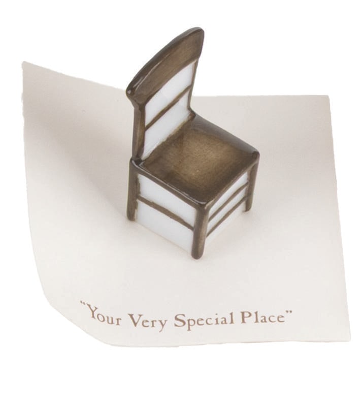 A Mini "Winnie the Pooh" Wooden Chair Figurine.: (Michel and Co., 1990s) A mini "Winnie the Pooh" ceramic figurine of a wooden chair inspired by the original illustrations for the books by E. H. Shepard. The figurine is attached to a card with a quo