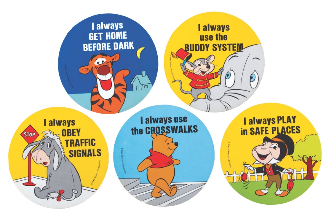 A Set of 1970s Disney Safety Stickers.: (Disney, 1970s) Six circular stickers featuring Tigger, Pooh, Eeyore, Jiminy Cricket, and Timothy Mouse sharing safety tips for kids. Included are five different designs with a duplicate of Pooh.