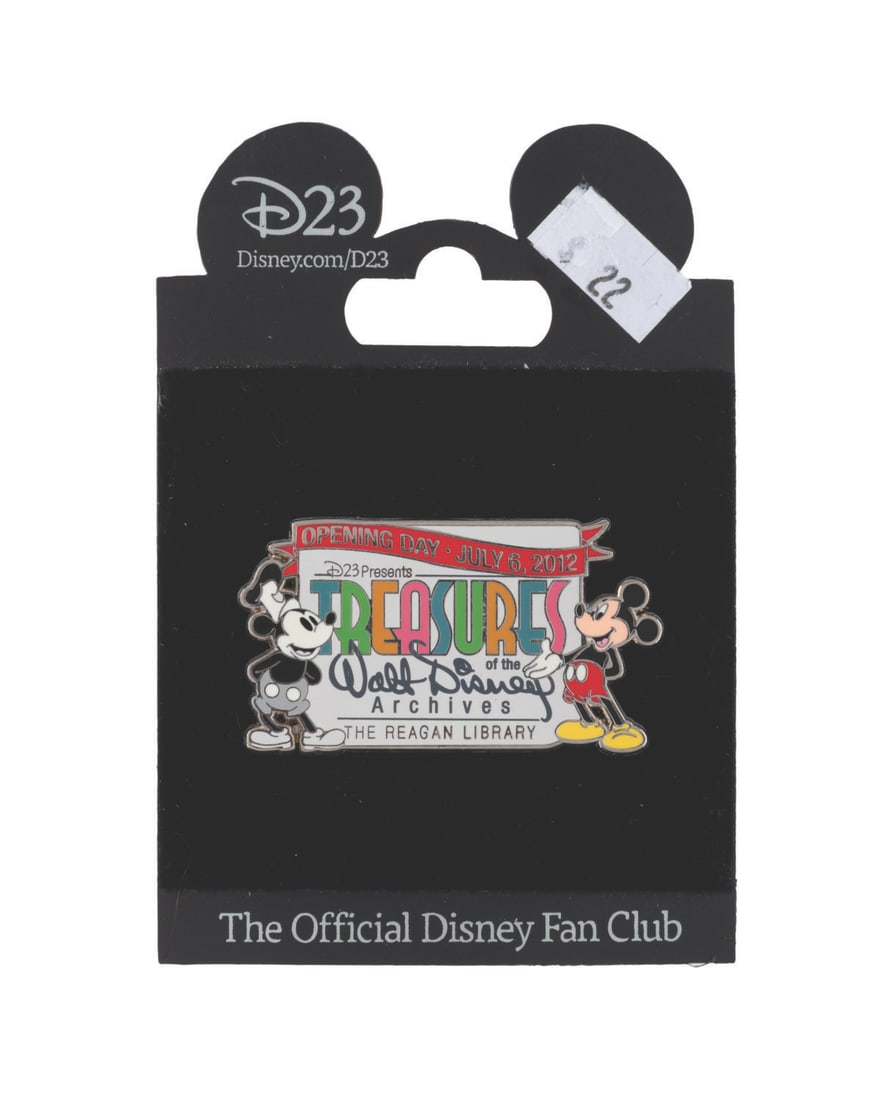 A Treasures of the Walt Disney Archives Pin.: (Disney, 2012) An opening day pin for the Treasures of the Walt Disney Archives exhibit at The Reagan Library on July 6, 2012. The pin is in fine condition on the original card.