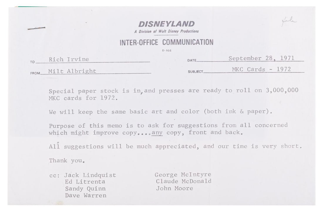 A Disneyland Magic Kingdom Club Memo and Sample Membership Card.: (Disneyland, 1971) A Disneyland inter-office memo addressed to Rich Irvine by Milt Albright regarding the printing of Magic Kingdom Club membership cards, including a sample of the card. Measuring 3.3