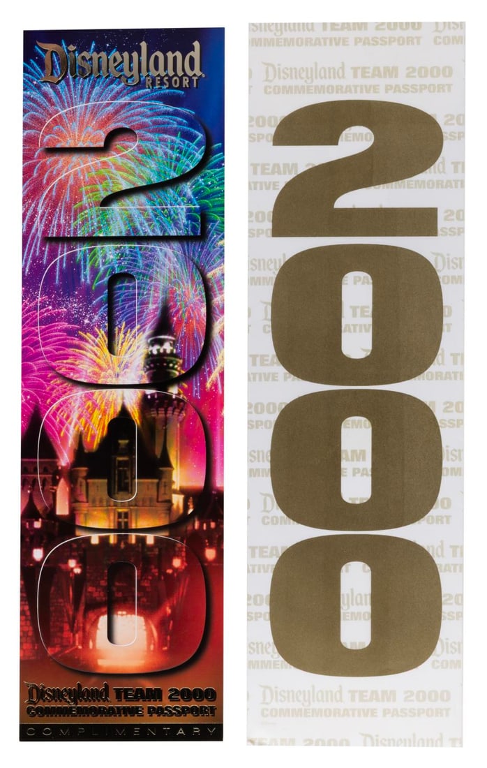 A Disneyland Team 2000 Commemorative Passport.: (Disneyland, 2000) An unused Disneyland Team 2000 commemorative passport, given exclusively to Cast Members. Measuring 4” x 14” with its original 4.25” x 14.25” envelope, the p