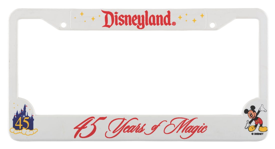 A Disneyland 45 Years of Magic Cast Member License Plate Frame.: (Disneyland, 2000) A Cast Member exclusive license plate frame from Disneyland's 45th anniversary celebration, reading "45 Years of Magic.” Measuring 6.25” x 12.25”, the plastic