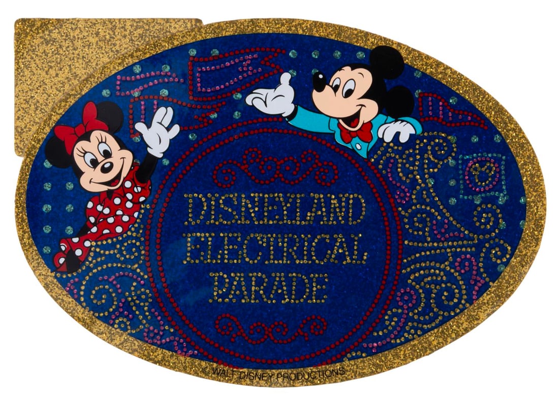 A Disneyland Electrical Parade Sticker.: (Disneyland, 1970s-80s) A sparkly sticker for the Main Street Electrical Parade at Disneyland. Measuring 4” x 5.75”, the sticker is in very good condition with light discoloration to the