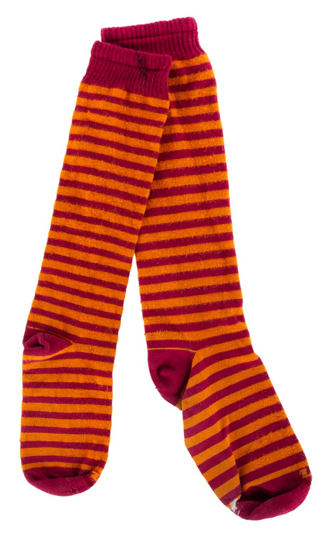 A Pair of Pirates of the Caribbean Cast Member Socks.: (Walt Disney World, 1990s-2000s) A pair of striped socks worn by Cast Members working at the Magic Kingdom’s Pirates of the Caribbean attraction. The one size fits all socks display in very good con