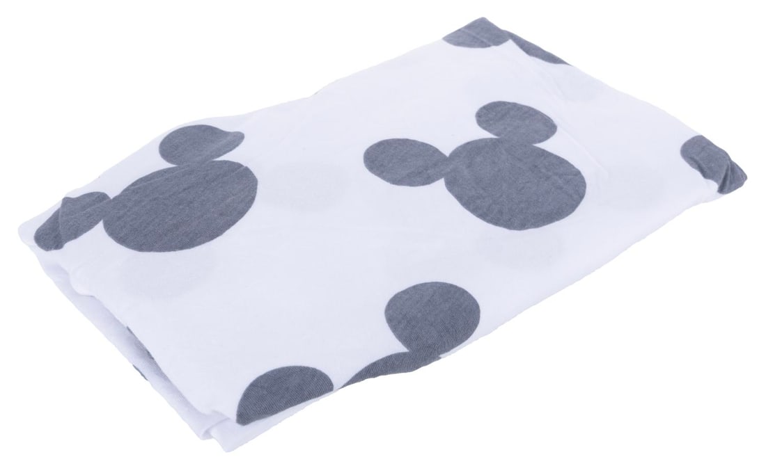 A Walt Disney World Resort Mickey Mouse Crib Sheet.: (Walt Disney World, 2000s) A crib sheet featuring a Mickey Mouse head motif used at several resorts across the Walt Disney World Resort. Measuring 19.5” x 30” the sheet is in very good con