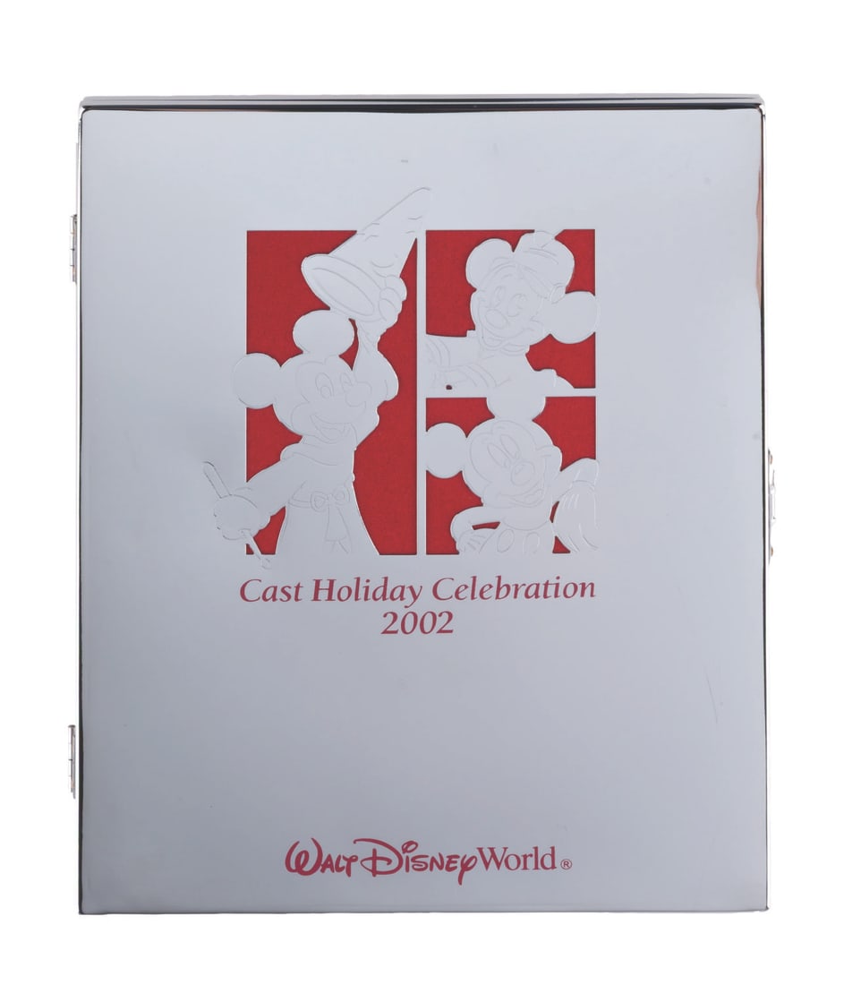 A Walt Disney World Cast Exclusive Holiday Photo Frame.: (Walt Disney World, 2002) A picture frame from the 2002 Cast Holiday Celebration at Walt Disney World. Measuring 6.75" x 8.5", the frame is in very good condition with scratches and light wear.