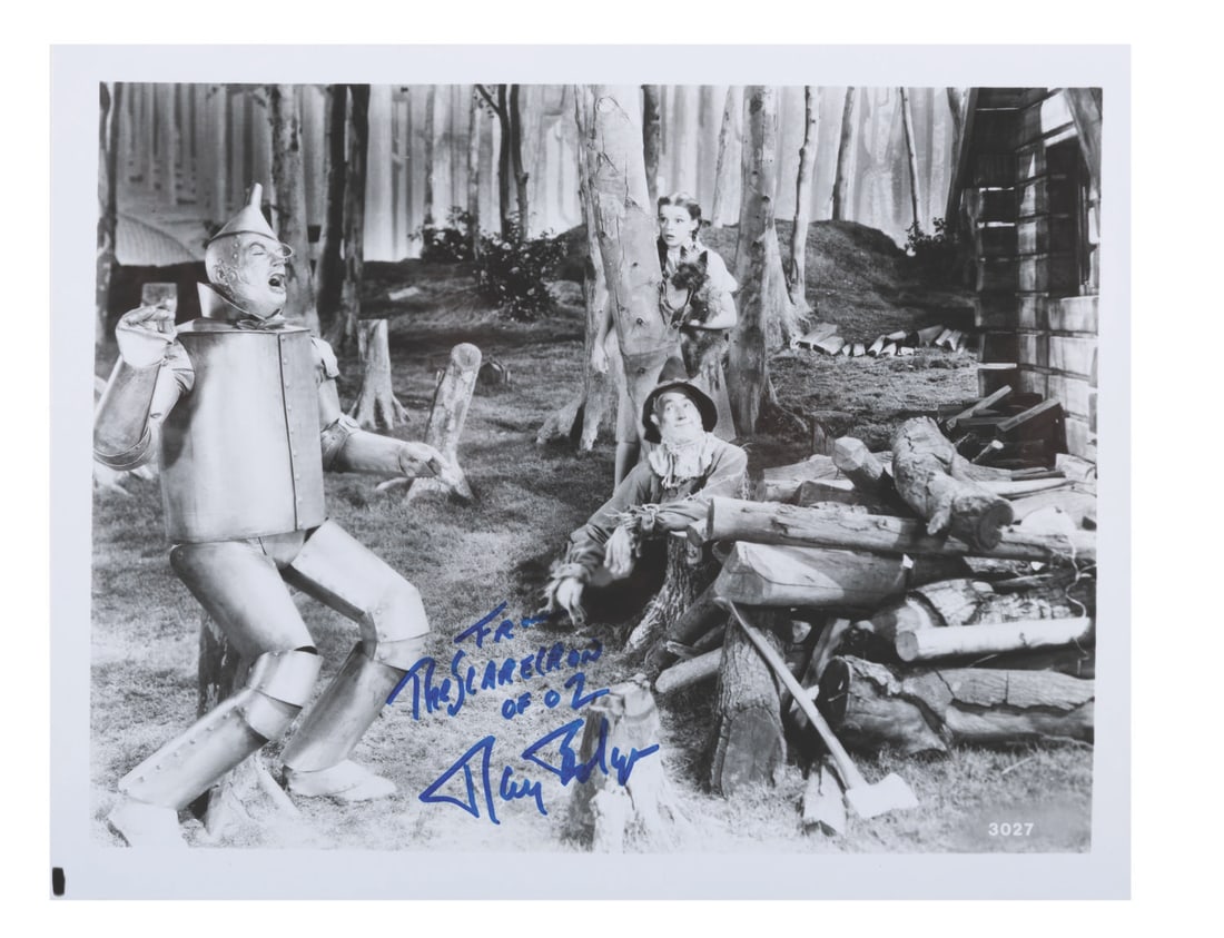 A "The Wizard of Oz" Signed Photo.: (MGM, 1980s) A publicity photo from "The Wizard of Oz" signed by actor Ray Bolger, who portrayed the Scarecrow in the classic film. Measuring 8" x 10", the photo displays in good condition with heavy