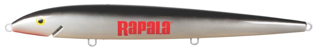A 6-Foot Rapala Fishing Lure Prop.: (Rapala, 2000s) A huge Rapala prop fishing lure, originally used as a store display. Rapala sells giant lures measuring 29" long for home display. Still, those fish are mere minnows compared to this