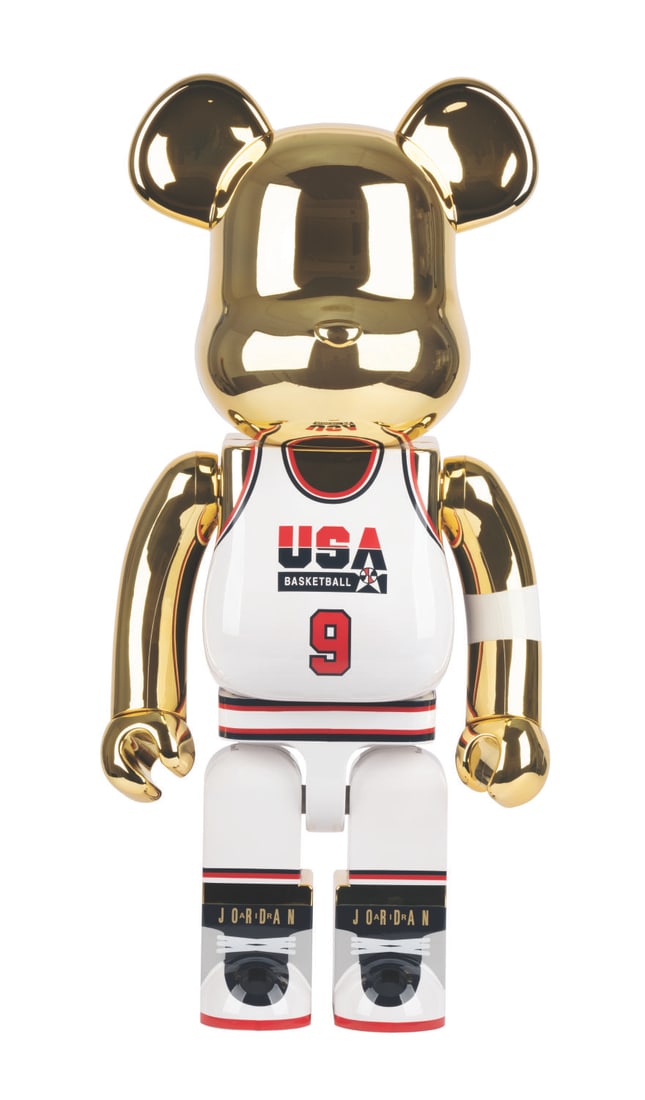 A BE@RBRICK Michael Jordan Dream Team 1000% Figure.: (MediCom, 2021) A rare large gold chrome BE@RBRICK 1000% figurine wearing Michael Jordan's #9 Team USA jersey. "Air Jordan" led the squad, nicknamed the "Dream Team," to a gold medal finish at the 199