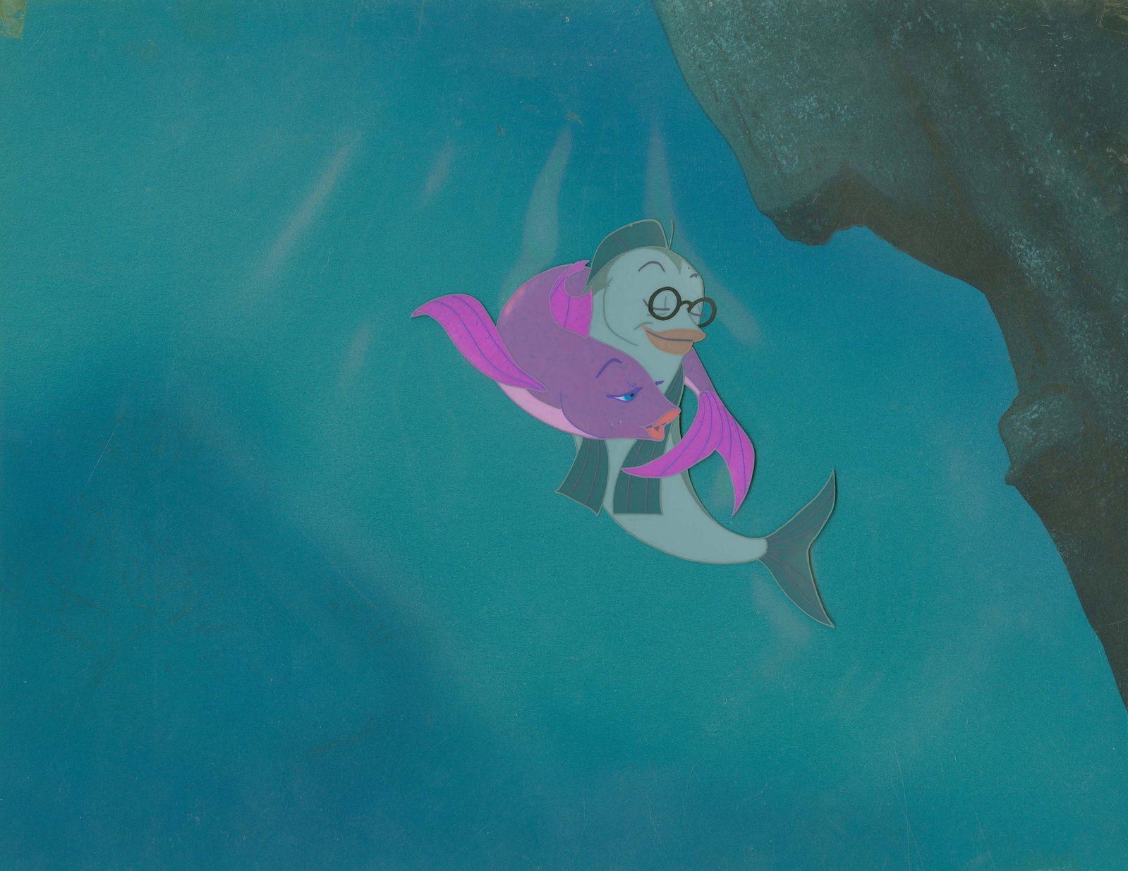 A "The Incredible Mr. Limpet" Production Cel & Background.: (Warner Bros., 1964) A hand-painted production cel and original background from "The Incredible Mr. Limpet." Ladyfish and Mr. Limpet have an image size of 4.5" x 4.75" on a 10.5" x 12.5" cel, while