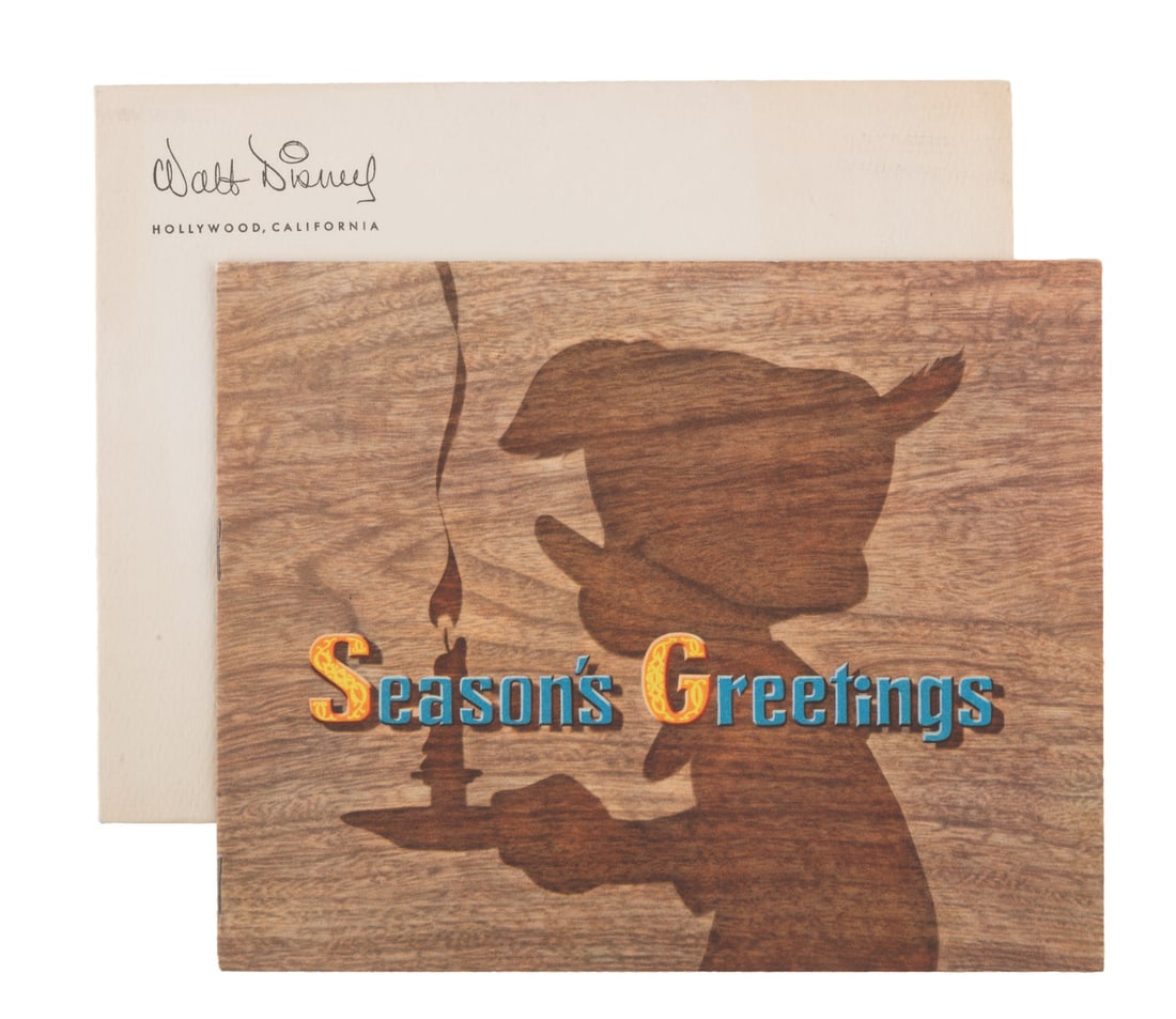 A 1939 Walt Disney Studio "Pinocchio" Christmas Card.: (Disney, 1939) A rare 1939 Walt Disney Studios Christmas Card featuring the cast of the Studio's upcoming feature "Pinocchio," with the original envelope. Measuring 6" x 7.5" closed, the card is in