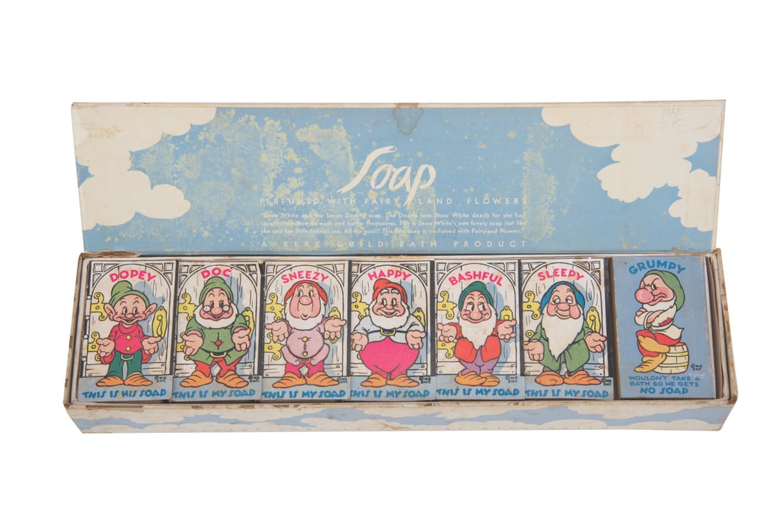 A "Snow White and the Seven Dwarfs" Soap Box Set.: (Kerk Guild, 1938) A boxed set of Snow White Soap by Kerk Guild Bath Products. Included are six soaps, except for "Grumpy" who "wouldn't take a bath so he gets no soap." Measuring 1.5" x 2.5", each