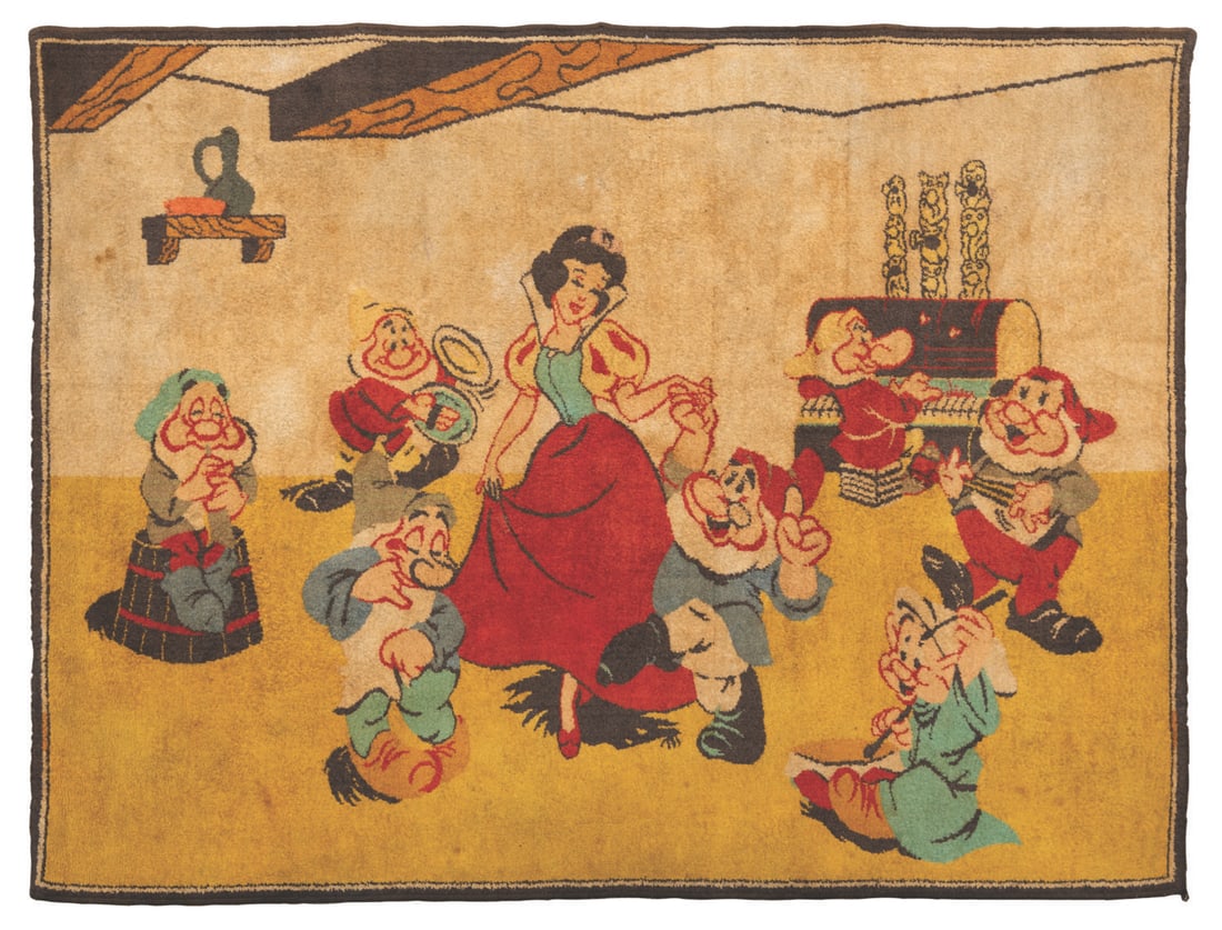 A "Snow White and the Seven Dwarfs" Rug.: (1930s-50s) A large "Snow White and the Seven Dwarfs" rug, inspired by The Silly Song musical sequence from the classic film. Measuring 45" x 59", the rug displays in good condition with a large stain