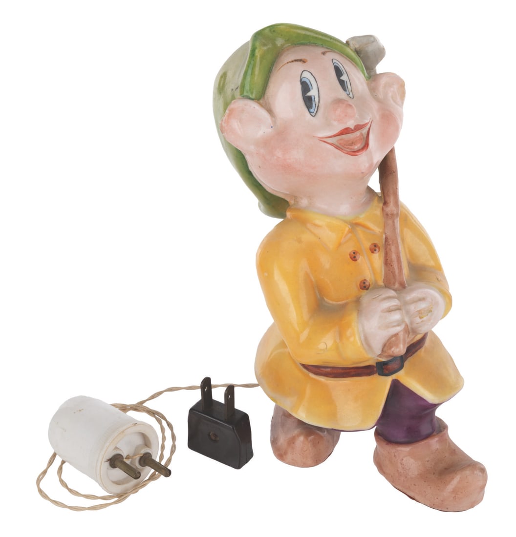 A "Snow White" Dopey Lamp by Casarte.: (Casarte, 1950s) A rare figural lamp of Dopey from "Snow White and the Seven Dwarfs," created by Casarte of Italy. The lamp is sold untested and may require service to function. Measuring 5.25" x 3.75