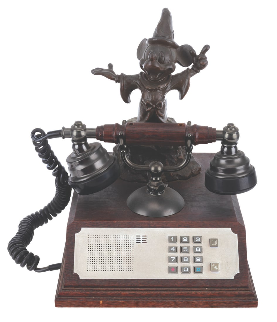A Disney Licensee's Association Sorcerer Mickey Telephone.: (Disney, 1987) A Sorcerer Mickey telephone commemorating the 25th anniversary of the Disney Licensee's Association. Numbered 221 of only 300, the phone may require service to function. Measuring 9" x