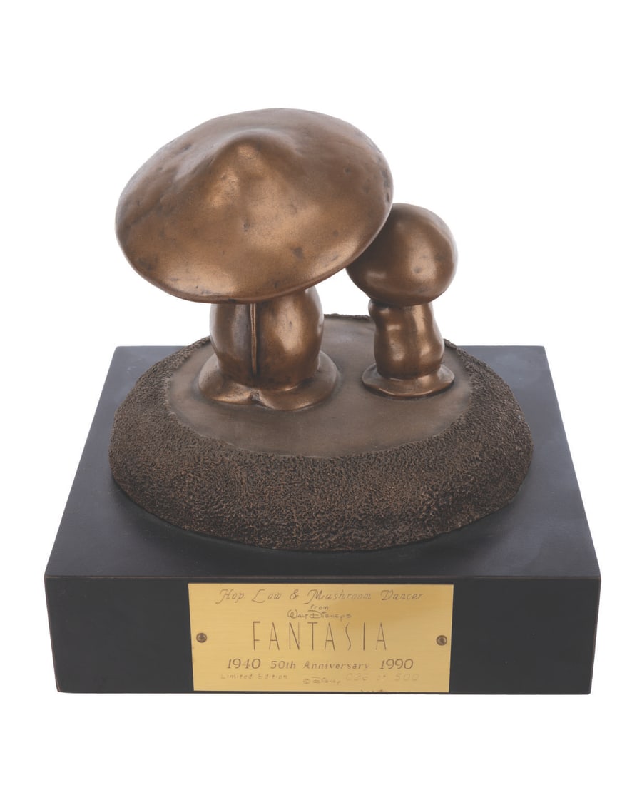 A "Fantasia" Hop Low & Mushroom Dancer Sculpture.: (Disney, 1990) A sculpture of Hop Low and a mushroom dancer from the Nutcracker Suite segment of "Fantasia." Released in a limited edition for the film's 50th anniversary, the resin statue is