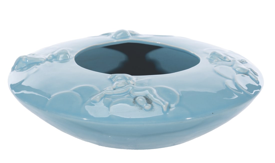 A "Fantasia" Ceramic Sprite Bowl.: (Vernon Kilns, 1940) A solid blue "Fantasia" sprite bowl by Vernon Kilns, featuring the cupids from the Pastoral Symphony segment of the film. Measuring 10.25" in diameter x 3" tall, the ceramic bowl 