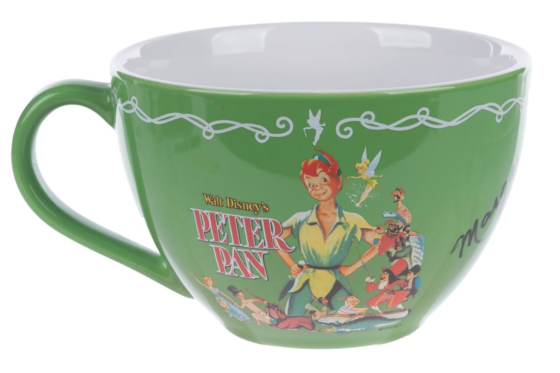 A Margaret Kerry Signed "Peter Pan" Mug.: (Disney, 1990s-2000s) A "Peter Pan" poster mug signed by Margaret Kerry, the live-action reference of Tinker Bell. Measuring 5" x 6.5" x 3.5" the mug is in fine condition.