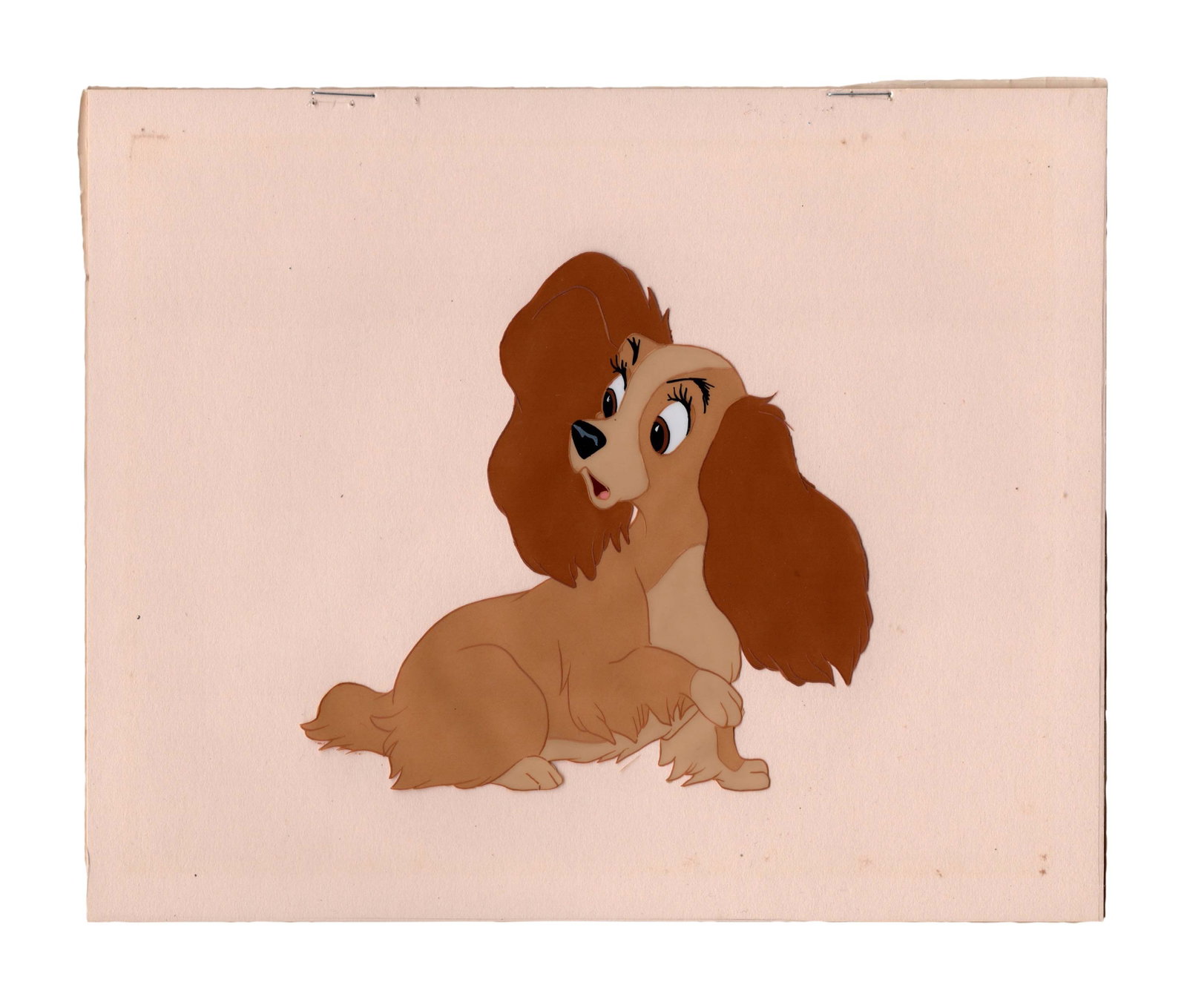 A "Lady and the Tramp" Original Production Cel.: (Disney, 1955) A hand-painted original production cel of Lady from "Lady and the Tramp." The cel was originally sold at the Art Corner in Disneyland, and still has the original backing with the Art Co