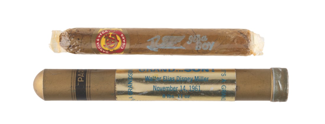 Walt Disney's "It's a Grandson!" Birth Announcement Cigar.: (Disney, 1961) An extremely rare cigar that was personally given by Walt Disney to celebrate the birth of his grandson, Walter Elias Disney Miller. Walt had always wanted a grandson to carry his