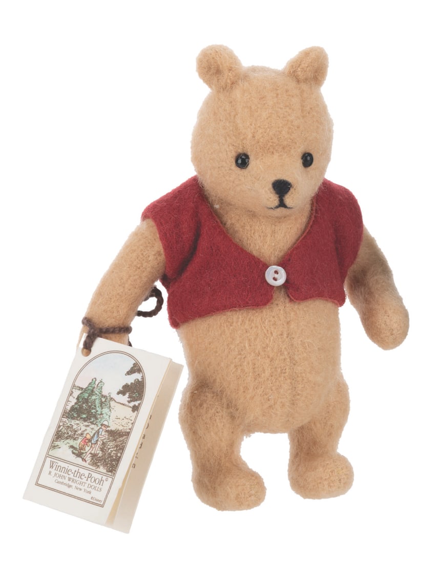 A Winnie the Pooh "Pocket Pooh" R. John Wright Doll.: (R. John Wright, 1993) A limited edition "Pocket Pooh" Winnie the Pooh doll by R. John Wright, numbered 1605 of 3500. The bear is complete in its original box with Certificate of Authenticity, registr