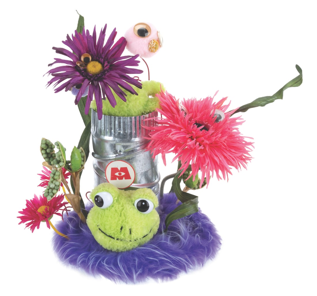 A "Monsters Inc." Screening Event Table Centerpiece.: (Disney, 2001) A handcrafted "Monsters, Inc." screening event centerpiece. Measuring 10" x 14" x 15.5" tall, the mixed-media centerpiece is in very good condition with light soiling and discoloration