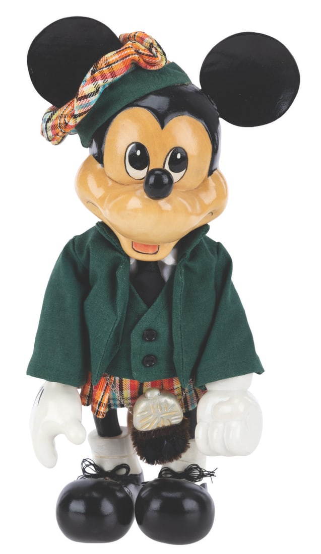 A Scottish Mickey Figure by Robert Raikes.: (Disney, 1990s) A hand-carved Scottish Mickey figure by artist Robert Raikes with the original box. The figure is numbered 45 of only 100 and features a wooden head, body, hands, and legs, with an