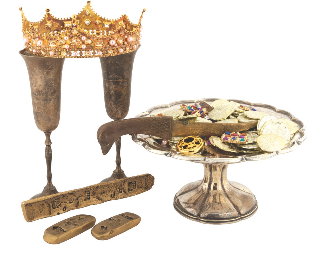A "Pirates of the Caribbean" Prop Treasure Hoard.: (Disney, 2003) A collection of 89 Isla de Muerta treasure props from "Pirates of the Caribbean: The Curse of the Black Pearl." The props include 65 coins, 16 bejeweled brooches, 2 candlesticks, 2
