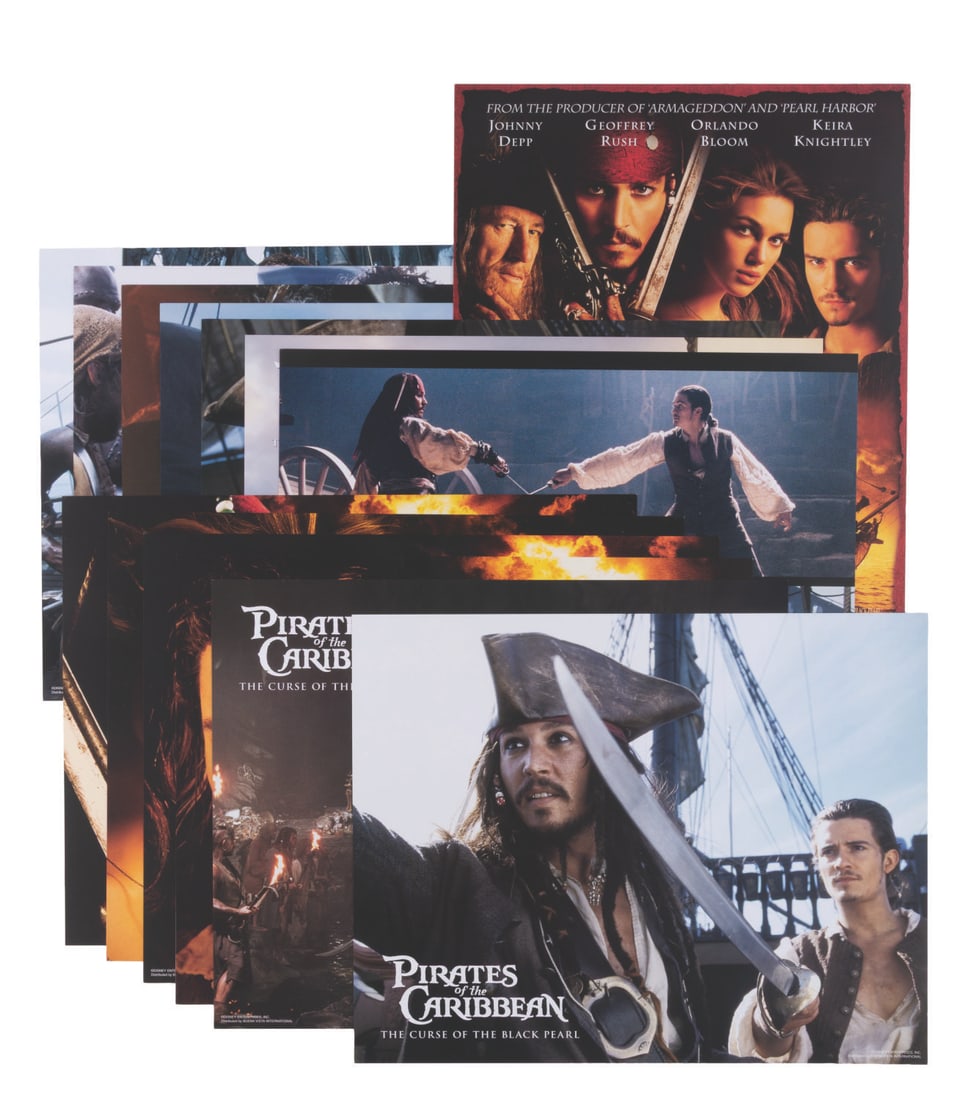 A Set of "Pirates of the Caribbean: The Curse of the Black Pearl" Lobby Cards.: (Disney, 2003) A complete set of 13 lobby cards for "Pirates of the Caribbean: The Curse of the Black Pearl." The cards feature scenes from the film with Johnny Depp, Keira Knightley, Orlando Bloom,