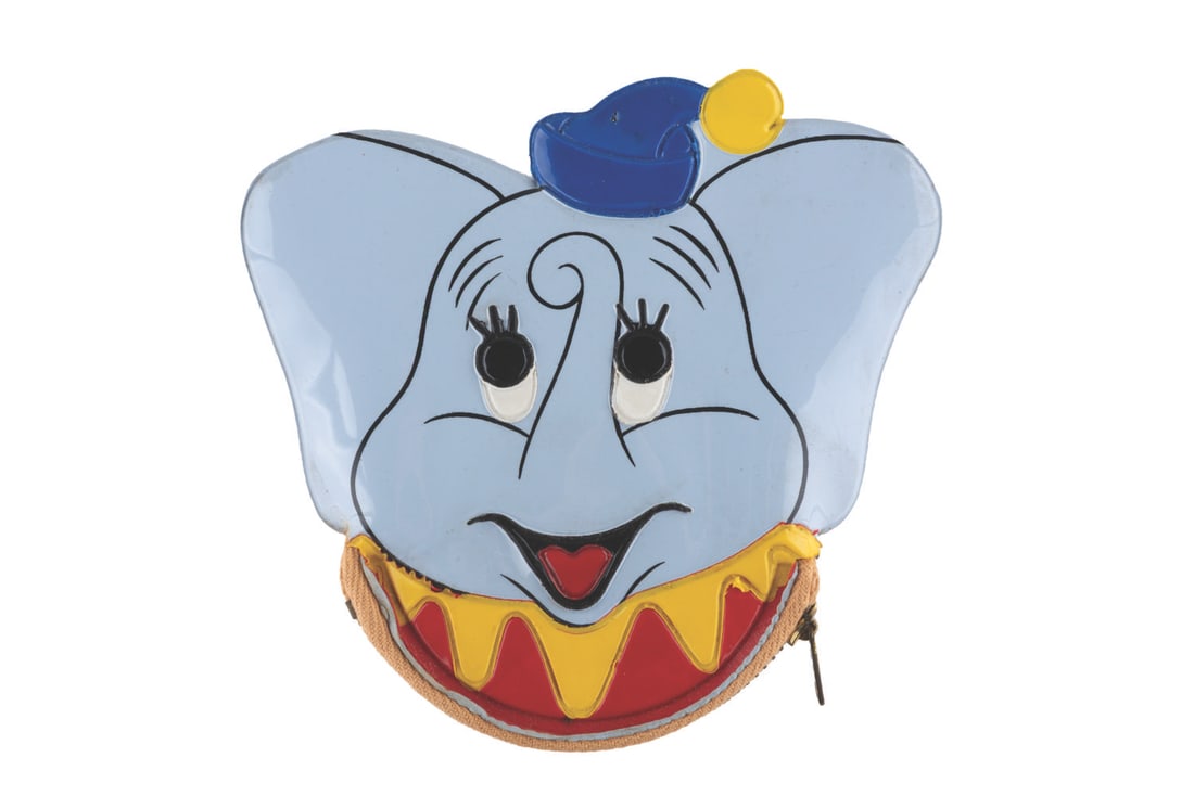 A Dumbo Squeaker Coin Purse Product Sample.: (Disneyland, 1970s) A Dumbo-shaped squeaker coin purse from the collection of Disneyland's Merchandise Manager, Jack Olsen. This coin purse was one of Olsen's product samples, and both the zipper and 