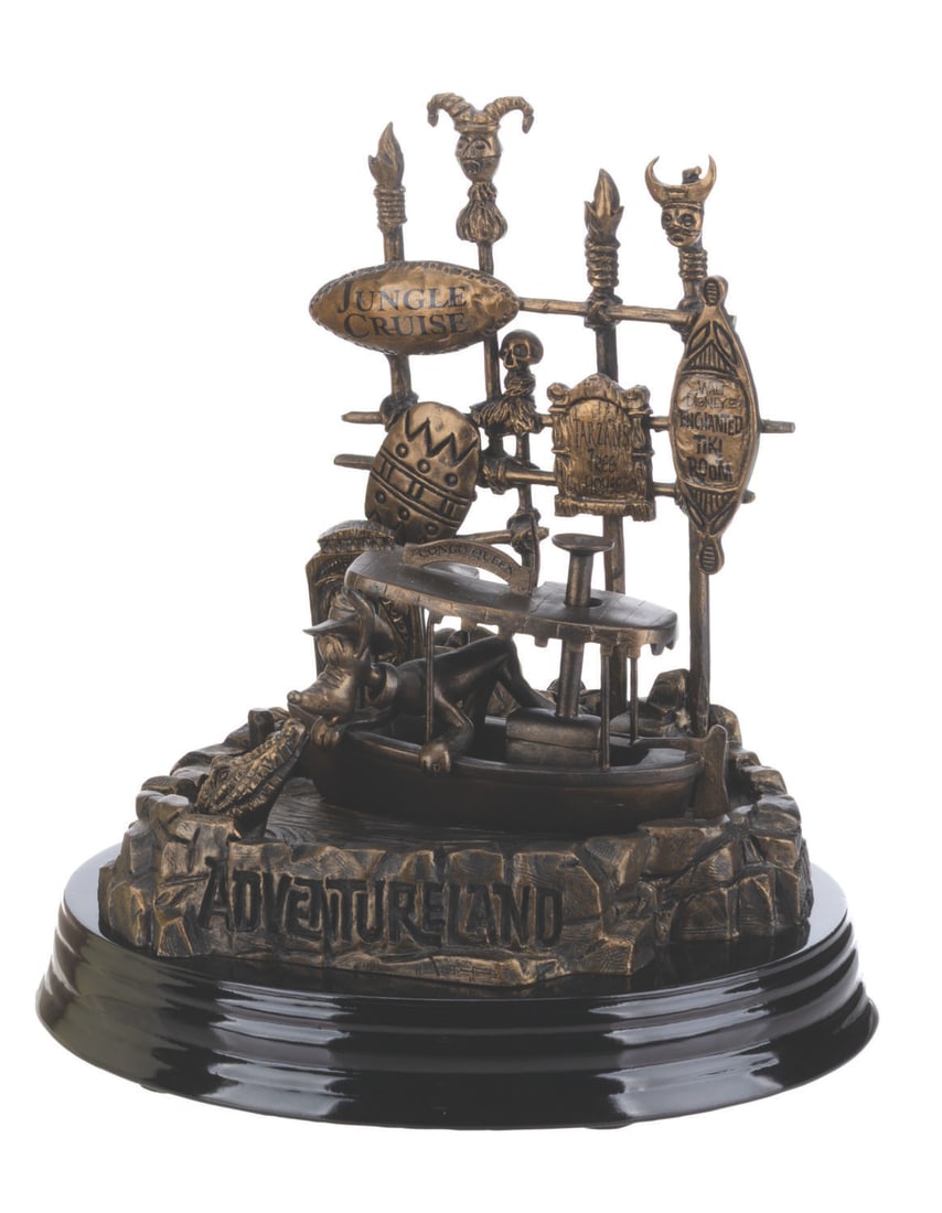 An Adventureland 50th Anniversary Figurine by Larry Nikolai.: (Disneyland, 2005) An Adventureland figurine by Larry Nikolai for Disneyland's 50th anniversary. This Disneyland Artist Figurine Series piece features Pluto aboard the Congo Queen. Measuring 6.25" x