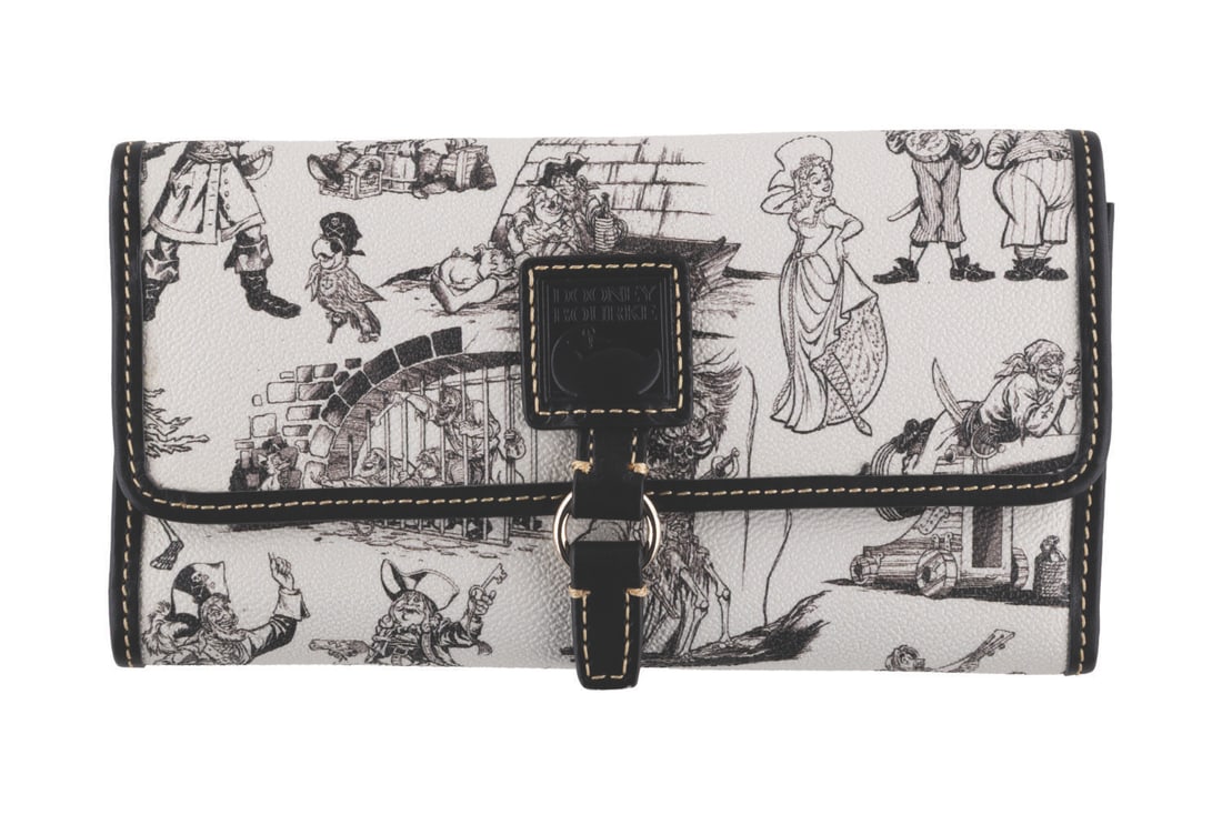 A Dooney & Bourke Pirates of the Caribbean Wallet.: (Dooney & Bourke, 2017) A Pirates of the Caribbean concept art wallet by Dooney & Bourke. Measuring 7.5" x 1.5" x 4.25", the wallet is in fine condition.