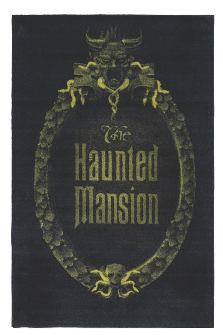 A Haunted Mansion Rug.: (Disney, 2000) A large Haunted Mansion rug featuring the attraction's logo. Measuring 42" x 65", the rug displays in good condition with wear and light fading.