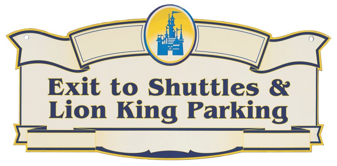 A Disneyland Exit to Shuttles & Lion King Parking Sign.: (Disneyland, 2000s) A Disneyland exit sign for shuttles and the Lion King Parking Lot. Measuring 19" x 40", the sign is in good condition with typical scratches, scuffs, and wear from Resort use.