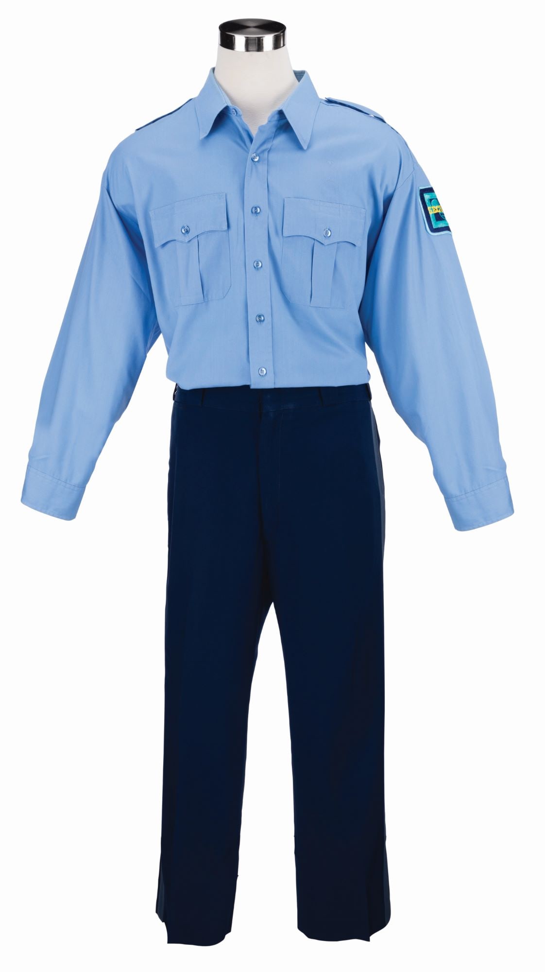 A Walt Disney World Security Uniform.: (Walt Disney World, 1990s) A security uniform from Walt Disney World featuring the original "D" logo with Mickey Mouse security patch on the left shoulder. The uniform includes a long-sleeved shirt