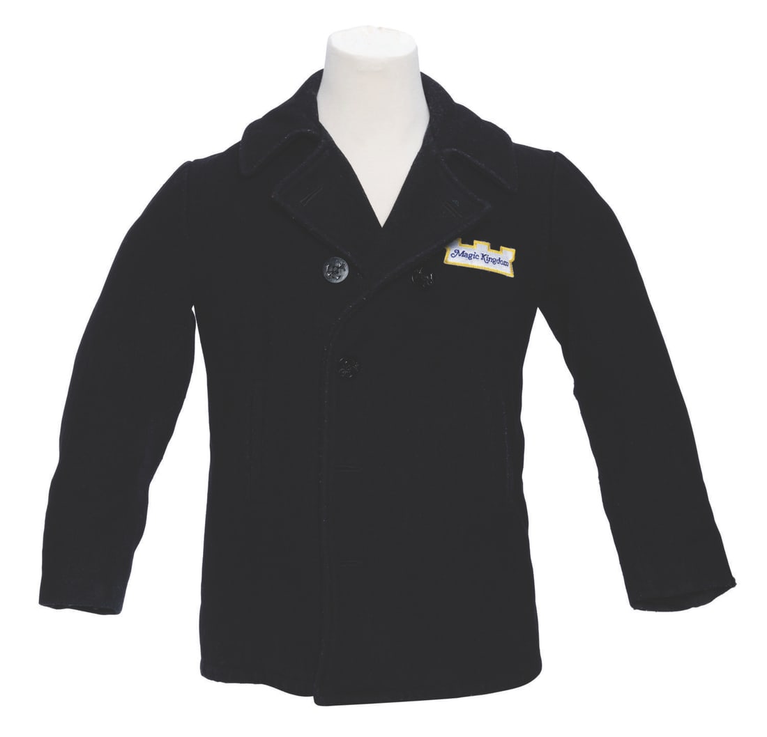 A Magic Kingdom Cast Member Peacoat.: (Walt Disney World, 1980s-2000s) A heavy peacoat for Cast Members working at the Magic Kingdom. Unlabeled but likely a size medium, the jacket displays in good condition with heavy pilling and wear